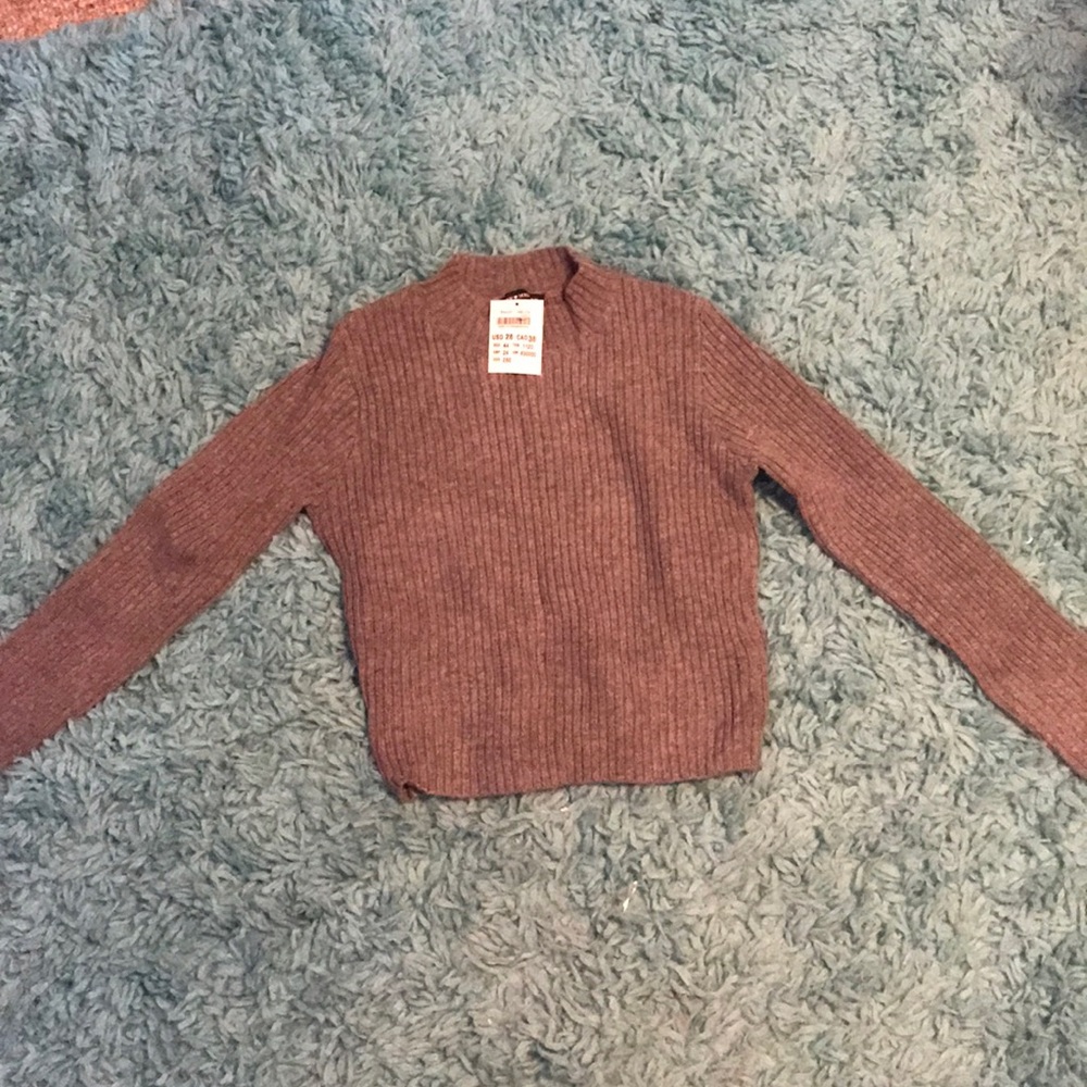 Grey sweater that has never been worn